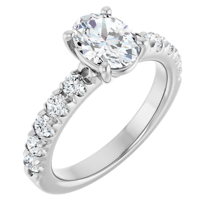 Oval White Gold Four Claw Set Style Engagement Ring