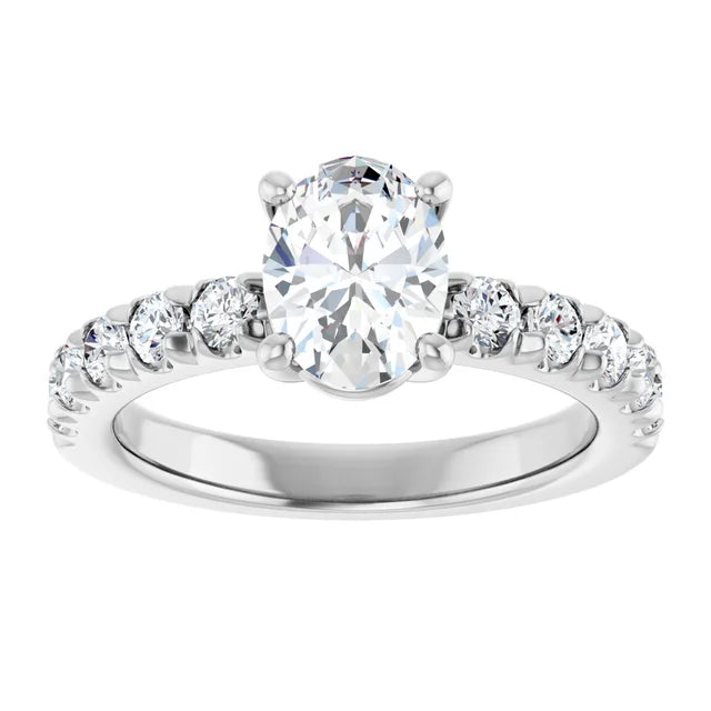 Oval White Gold Four Claw Set Style Engagement Ring
