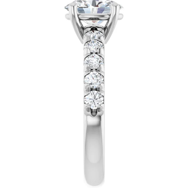 Oval White Gold Four Claw Set Style Engagement Ring